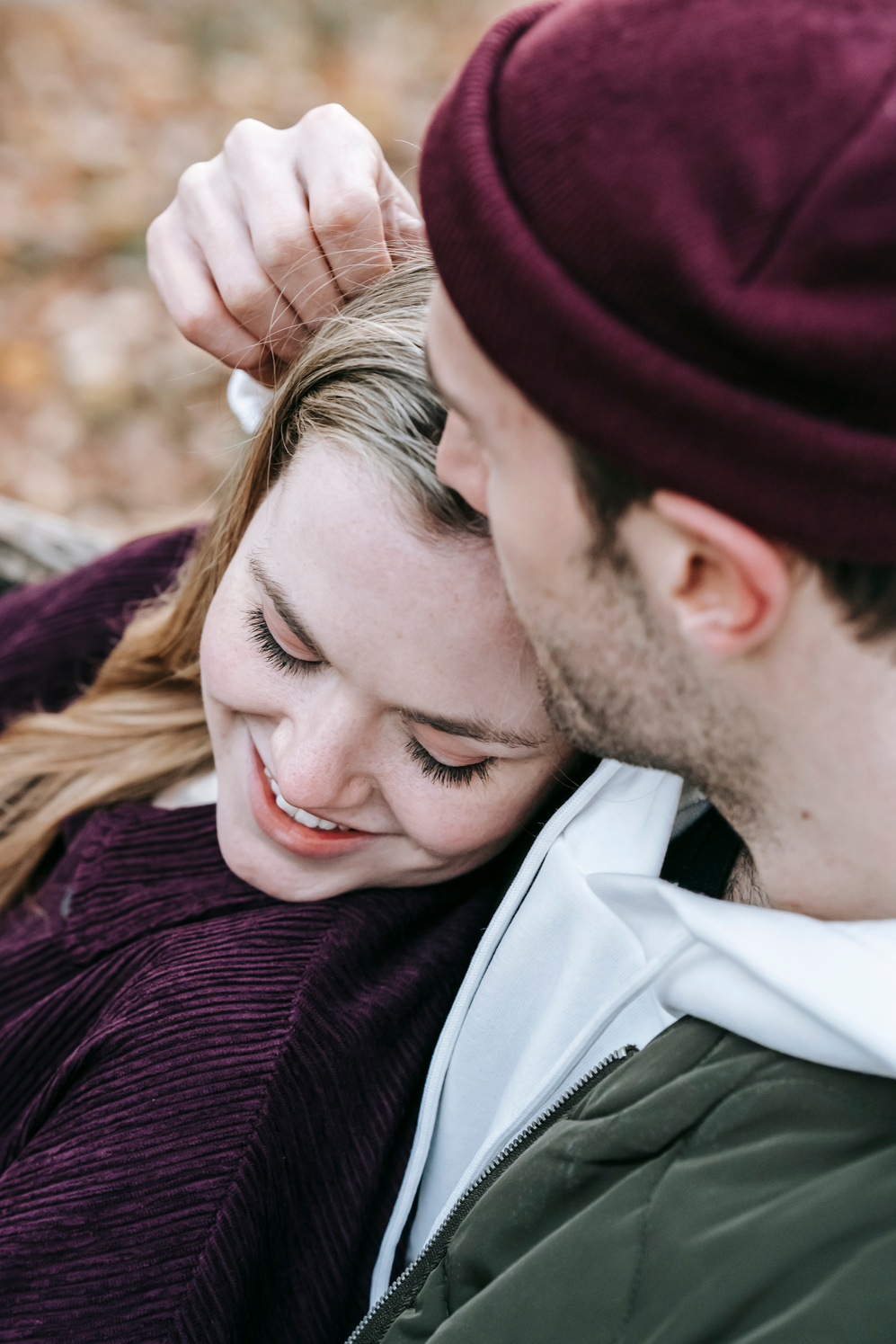 Loving couple on bench in park